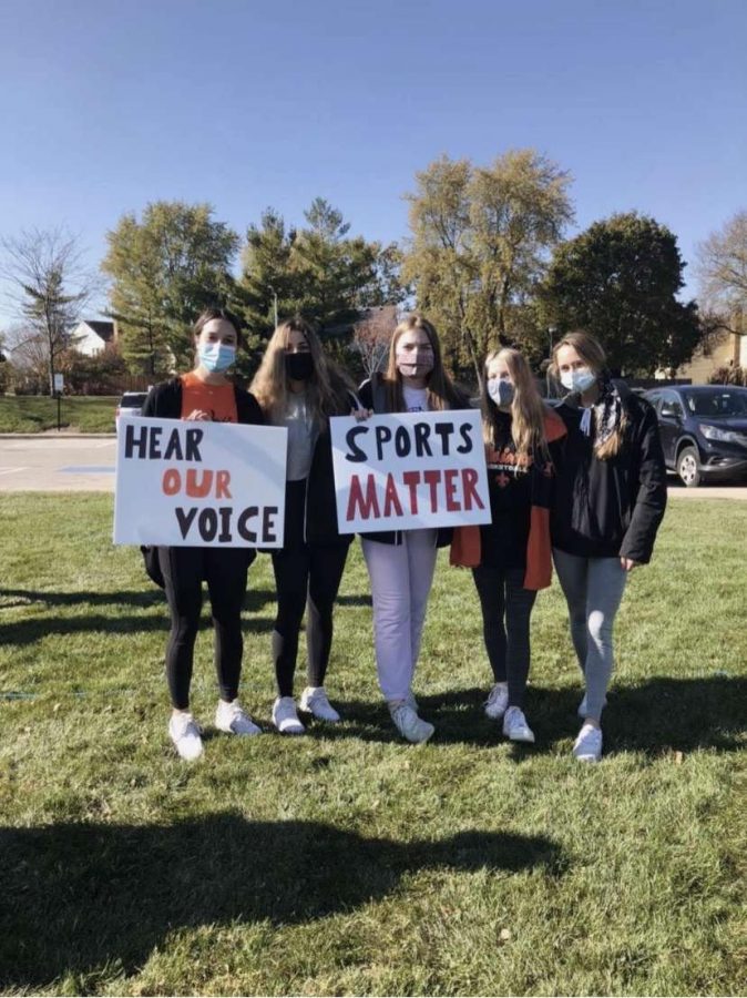 (From left to right), East girls’ basketball players Nina Scoliere, Torrie Kortan, Emma Yakey, Leah Griffin, and Makenna Brown show their support at the protest. Photo courtesy of Torrie Kortan.