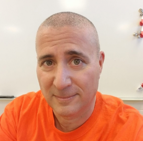 English teacher Anthony Gagliardi sports a new look after shaving his head. 
