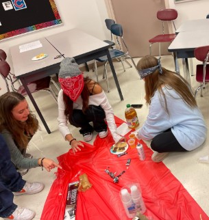 Students attending a Snowball meeting work on a collaborative snack-building activity.