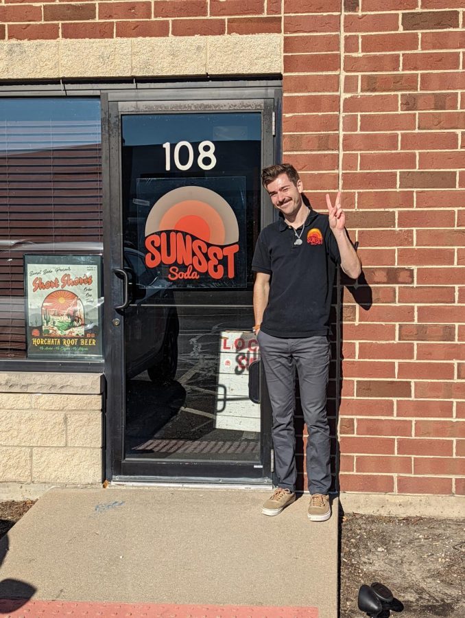 Frank Schniffer, co-founder of Sunset Soda, poses in front
of Sunset Soda’s Production Facility in Geneva. Photo by
Nia Cocroft