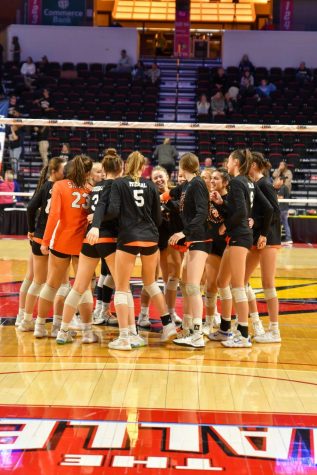 East’s Girls Volleyball Team exits a huddle during a State Finals match in Bloomington. Photo courtesy of 
Kate Goudreau.