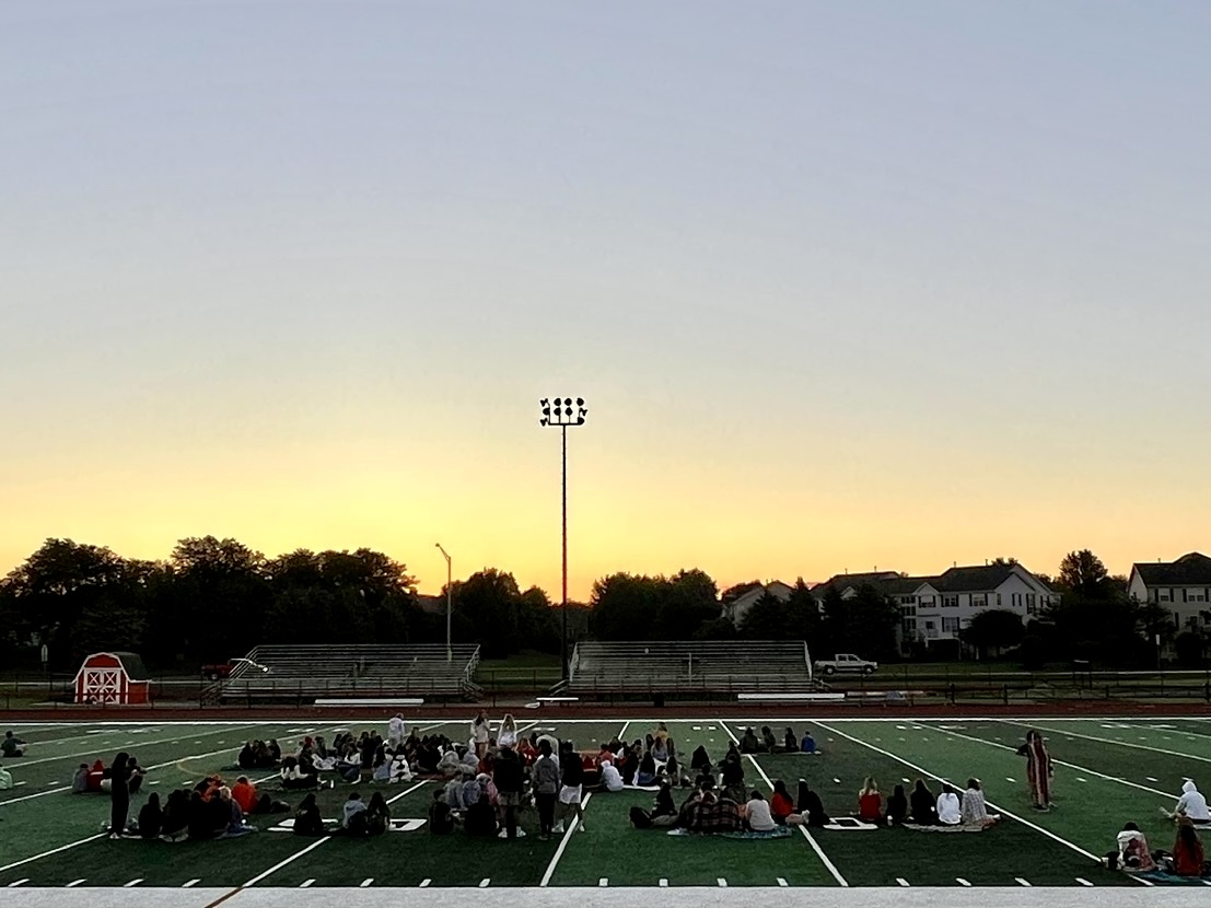 Seniors gather on Easts stadium to watch the sun rise ahead of the school day. Photo courtesy of Amanda Hayes
