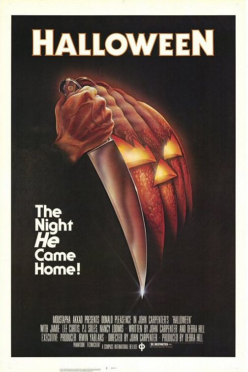 One of the main titles of the movie “Halloween” depicting a pumpkin holding a knife. Photo credits to Flicker