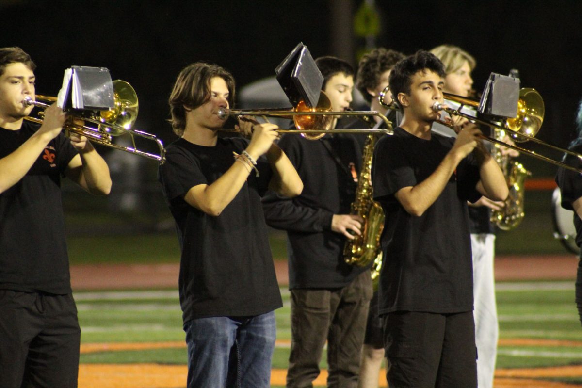  Seniors Tyler Robey (left) and Ethan Grimes (right) lead the trombone section through the concert.