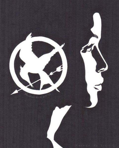 Katniss Everdeen and her Mockingjay pin as seen throughout the “Hunger Games” franchise. Art by Meghan-Vu.