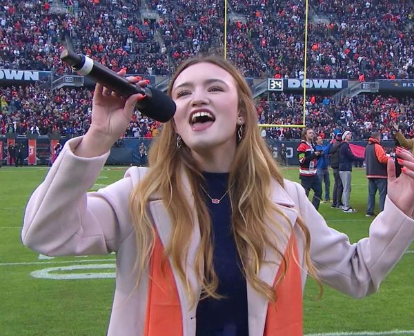 Mary Kate Schoessling sings the word “brave” at the end of the anthem. Photo courtesy of Jacob Funk.