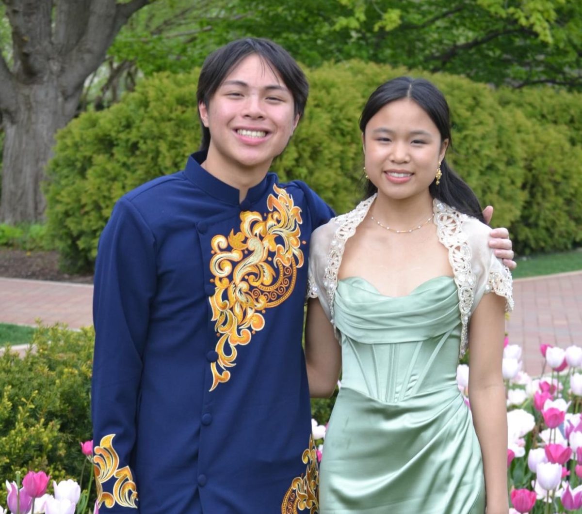 Senior Kenny Ngo (left) and senior Ava Brucal (right) wearing an áo dài and Filipino bolero respectively for prom. 