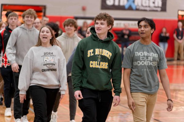 (Left to right) Seniors Ava Stippich, Owen McNally and Josh Zacharias walk in the Spring Recognition Assembly for earning the Seal of Biliteracy. Photo courtesy of St. Charles East High School Flickr.