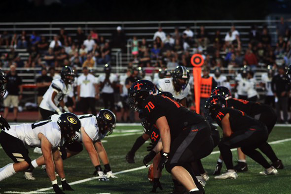 St. Charles East varsity football. Photo by Dino Vardalos, @kosta.shoots on Instagram.