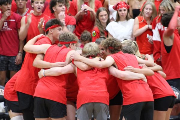 Seniors huddle up during their match. Photo by Lauren Voigt.