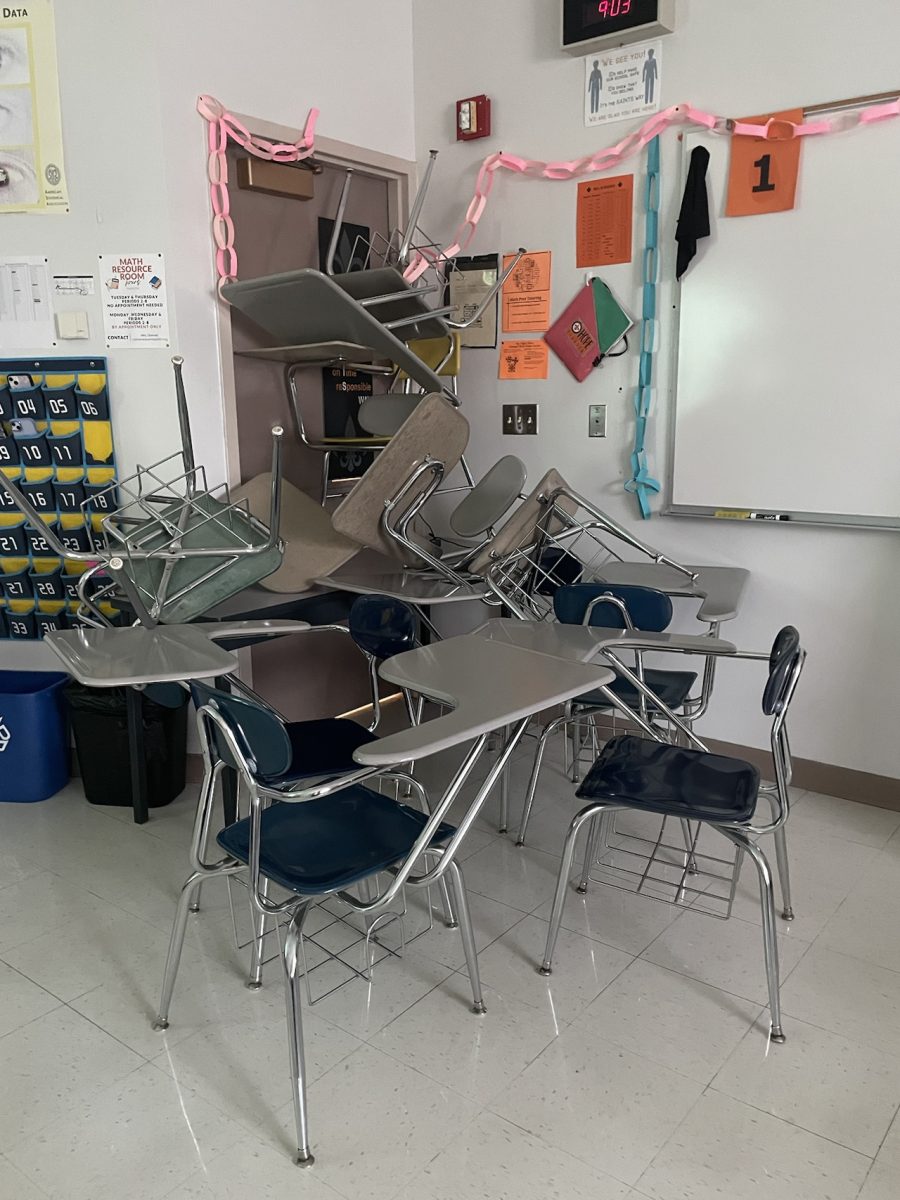 Desks and chairs are used to barricade a classroom door during the ALICE lockdown drill. Photo by Yzabelle de Luna.