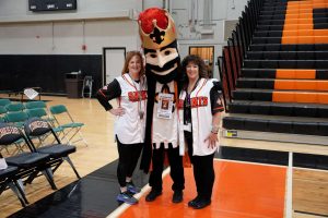 Lisa Dandre and Karen Kobler pose with King Charles at the 2024-2025 Winter Assembly. Photo courtesy of Flickr.