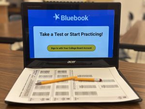 A depiction of the transition to digital AP testing as shown by a broken pencil over a Chromebook with the Bluebook interface on it. Photo by Yzabelle de Luna.