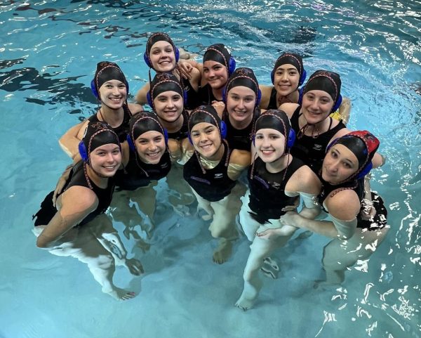 The East and North girls water polo co-op team poses in the pool. Bottom left to right: Olivia Klocker, Ellie Stippich, Malee Todd, Isla Tousignant, Trinity Lentz, Middle left to right: Lauren Slater, Liv Ciemiega, Becca Wlezien, Ari Barone, Top left to right: Ella McKenney, Evie Osborne, Gi Messina. 