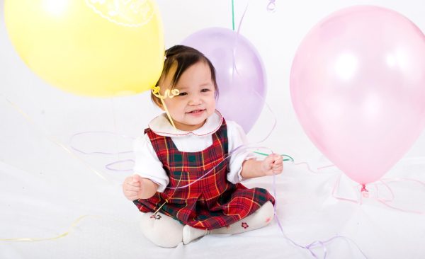 Senior Yzabelle de Luna opening gifts on her first birthday. Photo by Marie de Luna.