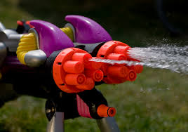 A squirt gun releases water. Photo courtesy of Flickr.