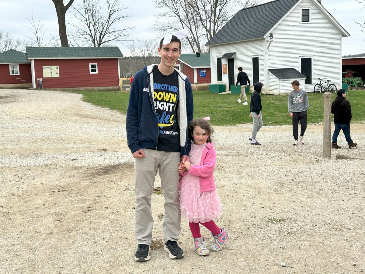 Senior Gabriel Wollak stands at Bunny Bash with his sister Lily Wollak. Photo by Zahra Coyne.