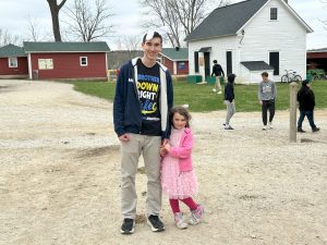 Senior Gabriel Wollak stands at Bunny Bash with his sister Lily Wollak. Photo by Zahra Coyne.