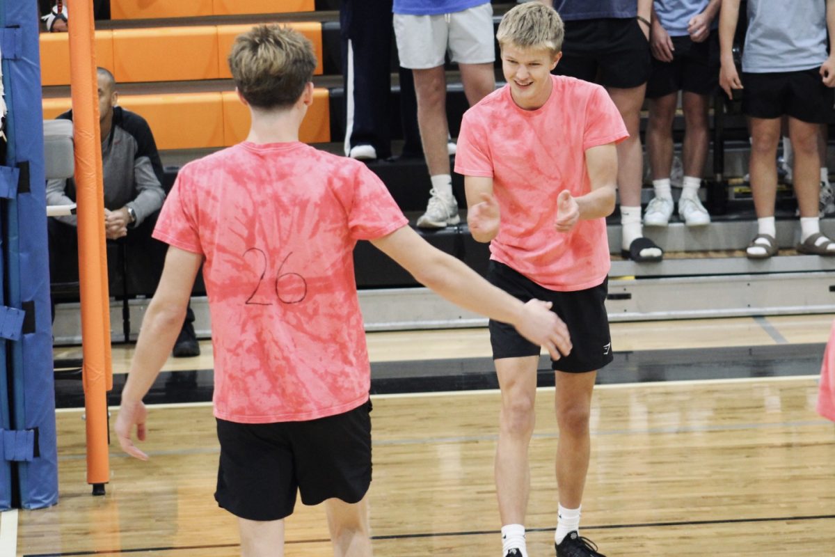 Senior players Cooper Jenson and Benjamin Nawa celebrating after scoring a point. Photo by Lauren Voigt. 