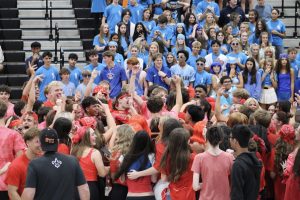 Seniors celebrate after their win in the Homecoming co-ed volleyball game. Photo by Lauren Voigt.