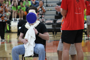 Pie-in-the-eye champion, Jon Ryan, being pied at Small Games. Photo by Lauren Voigt.
