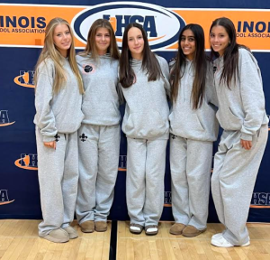 The girls’ tennis team at the IHSA state finals. From left to right: Lea Forsell (Sr.), Harper Charlson(Jr.), Greta Mazurova(Fr.), Layla Sutaria (Sr.), Kelsey Jacobs (Sr.) Photo courtesy of @STCE_Tennis on X