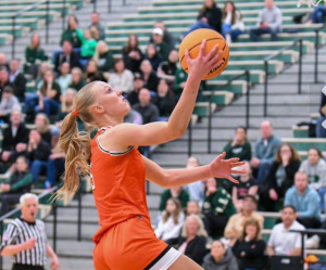 Brooklyn Schilb scoring at Bartlett High School against Glenbard West. Photo courtesy of Brooklyn Schilb.